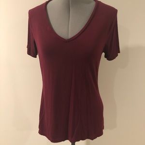 Set of 3 solid colored V neck shirts.